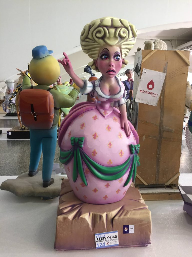 Fallas in Valencia experience ....a ninot of a woman in pink and green on display